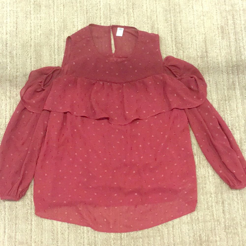 Dark red shirt.